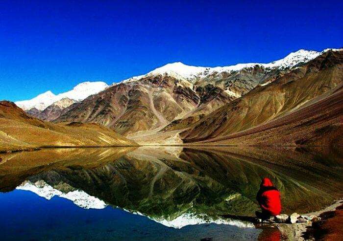 A splendid view of reflection of snow capped hills at Chandertal Lake