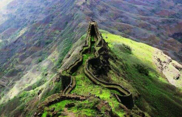 The top view of Torna Fort overlooking the valley during the rainy season