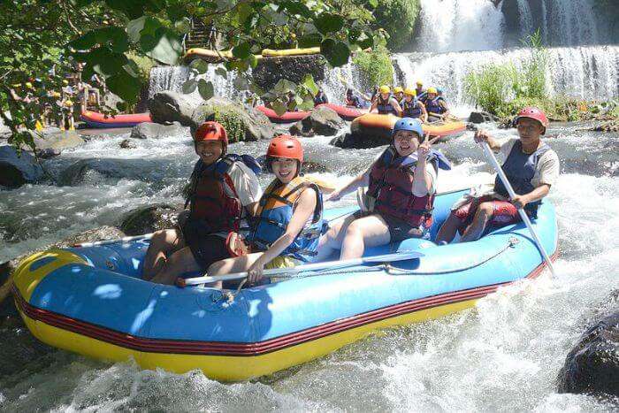 Tourists preparing for an exciting river rafting experience in the waters of Bali