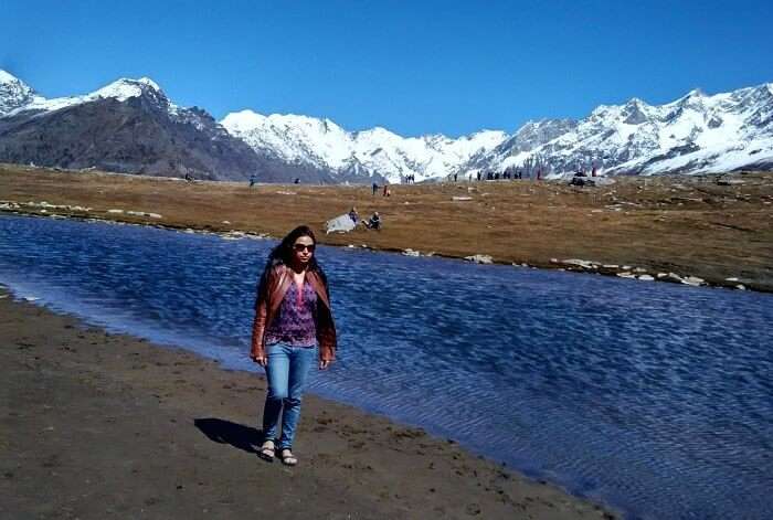 Rajeev's wife beside a stream in Rohtang Pass