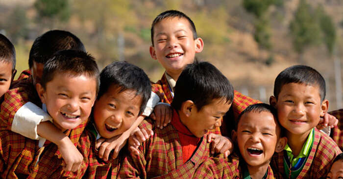 Happy kids smiling in the valleys of Bhutan