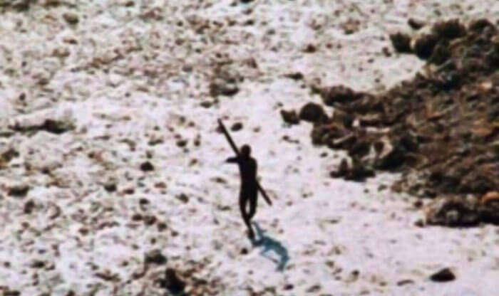 Sentinelese tribesman aiming arrow at the relief helicopter