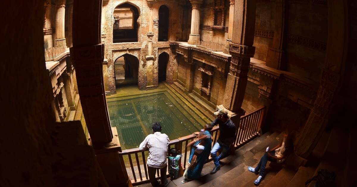 Visitors admire the architecture of Adalaj Ki Vav stepwell near Ahmedabad