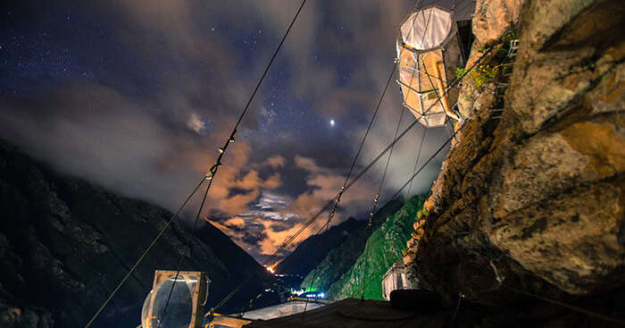 A night shot of skylodging in Peru