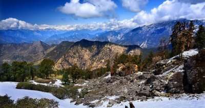 A snow-covered hill in Chopta