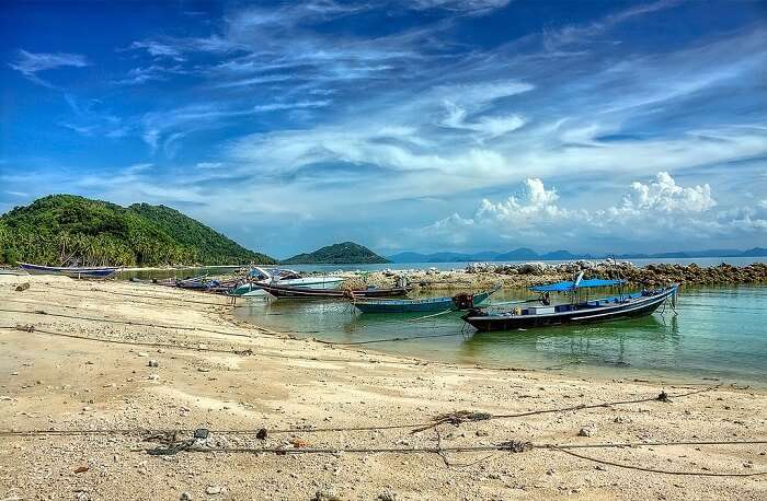 Fishing boats at the seashore of Taling Ngam Beach