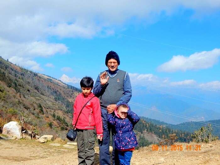 Pragatis children and father near Chelela Peaks in Bhutan