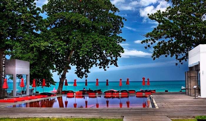 A view of the swimming pool at the Library Resort and the beach