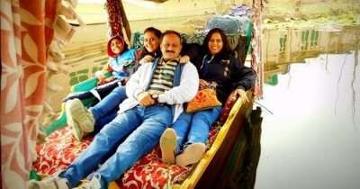A family takes a shikara ride in Kashmir