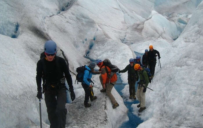 Hikers going through a tiring and difficult trek to the ice caves