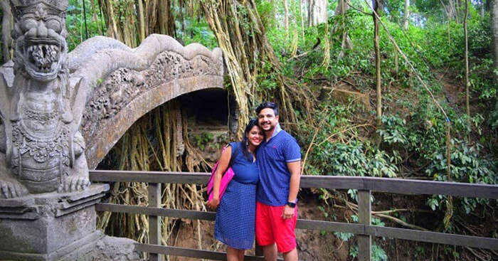 Amit poses with his wife on a honeymoon trip to Bali