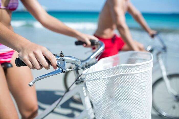 Couple riding bikes to get to and fro on islands in Lakshadweep