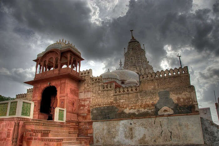The cloud-covered sky over the grand Shri Laxminath Temple that is one of the religious places to visit in Bikaner