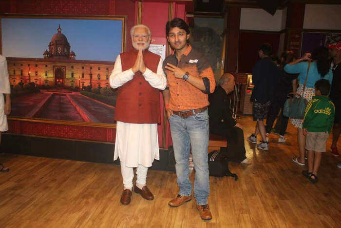 Mitul with a wax statue of Modi in Hong Kong