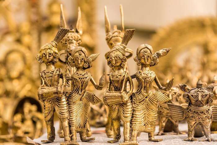 Brass and wooden idols at display at Lake Palace Road - one of the best places for street shopping in Udaipur