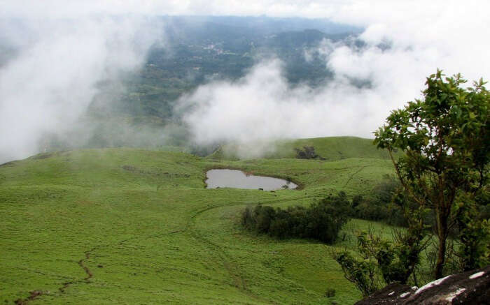 Heart shaped lake in cloud kissed Chembra Peak of Wayanad