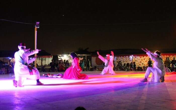 Cultural performance during overnight desert safari tour