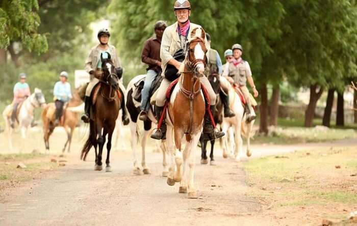 Tourists on a memorable horse safari in Rajasthan