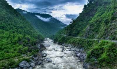 A majestic view of river in mountains which is one of the best places to visit in November in India