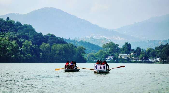 engaging in boating at bhimtal lake