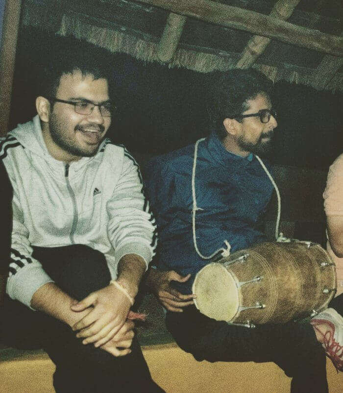 my friends playing dholak at the camp and singing songs