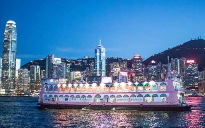 A cruise with Hong Kong skyline in backdrop