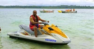 Kushal riding a water scooter during his honeymoon in Andaman