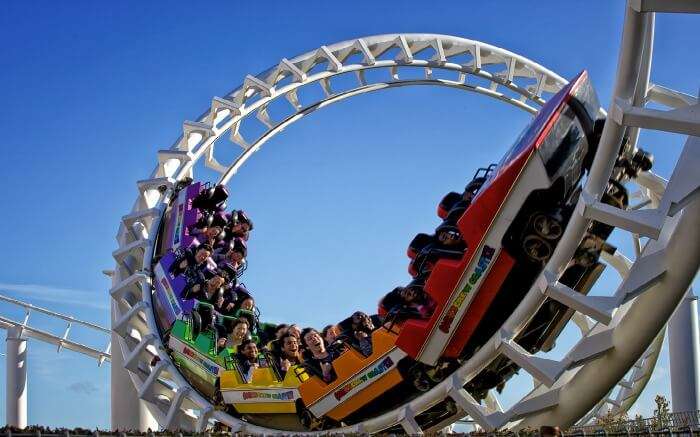 People enjoying rollercoaster ride in Rainbow’s End theme park in Auckland