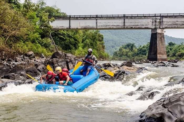 A group of adventure seekers rafting in Goa