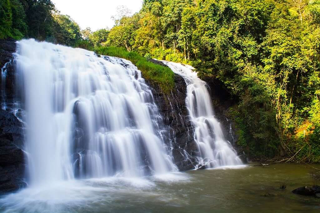 a beautiful waterfall in Coorg, which is among the must-visit tourist places in South India during summer