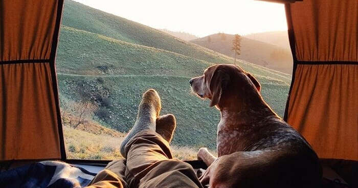 Maddie looking at a mountain from the tent