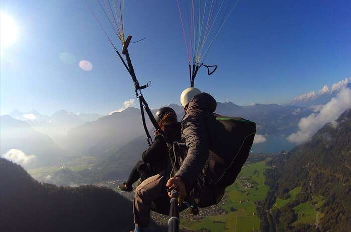 Honeymoon Couple paragliding in Switzerland