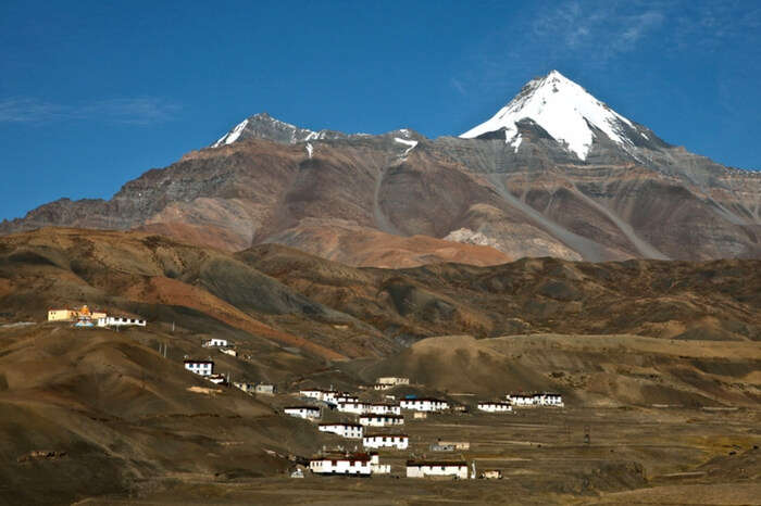 Snow capped mountains in the backdrop of Komic village in Spiti