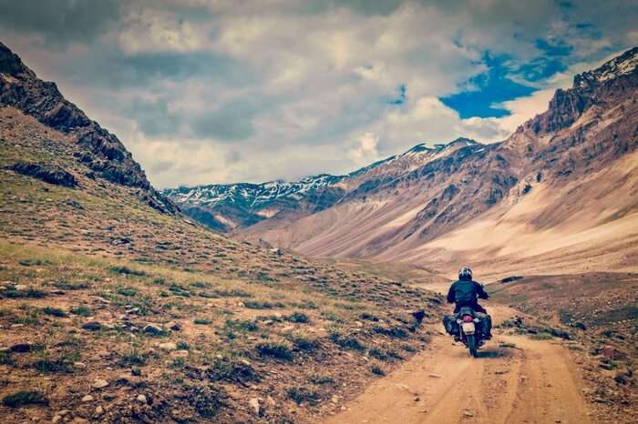 A biker on a mountain road in Spiti Valley