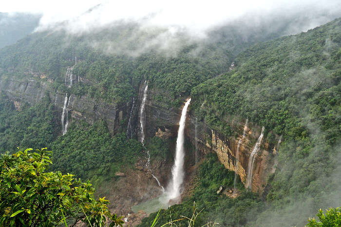 A beautiful waterfall in mountains of Cherrapunji which is one of the best places to visit in India in Summer