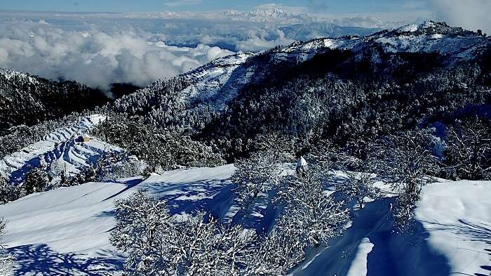 snowfall in Kanatal which is one of the peaceful places to visit in India in June