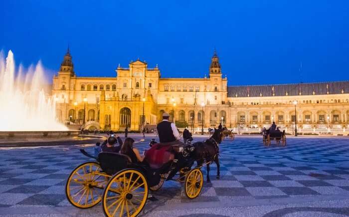 Horse carriage ride in Seville during evening