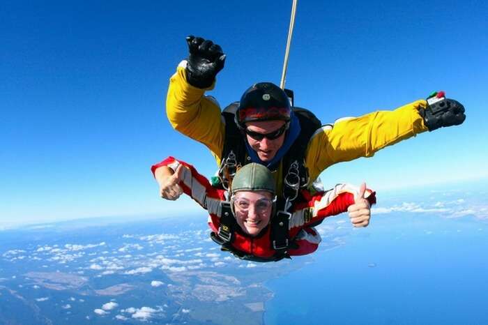 Skydivers during a freefall over Lake Taupo in New Zealand