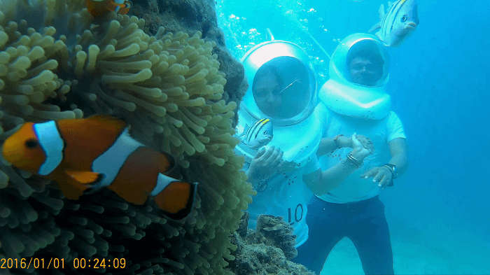 Couple enjoying Underwater seawalking in Andaman