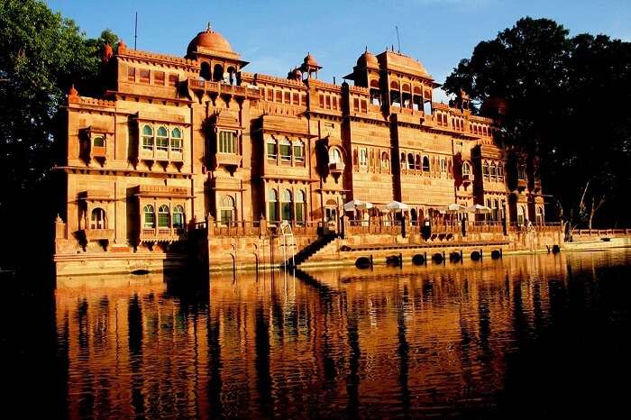 A shot of the Gajner Palace by the lakeside in Bikaner