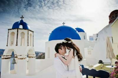 Romantic couple on a honeymoon in Santorini in Greece