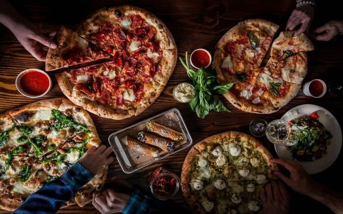 Top shot of pizza and other food items