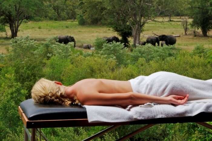 Honeymooner getting a massage during a safari honeymoon in Sabi Sand