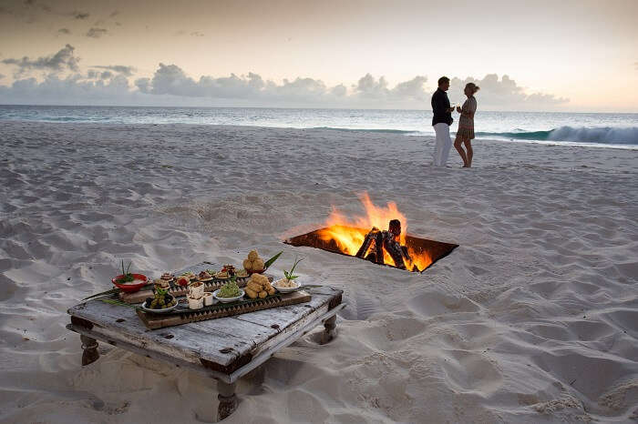 Couple dining by the beach in Seychelles