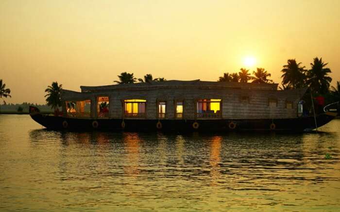 A houseboat in Kumarakom in Kerala at sunrise