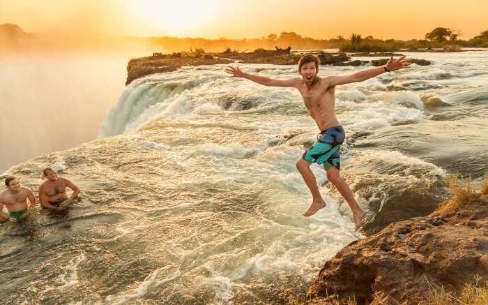 A guy diving in Devils Pool