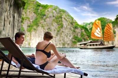 A couple relaxing by the Halong Bay in Vietnam