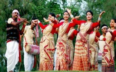 Assamese women and men dancing during Bihu festival