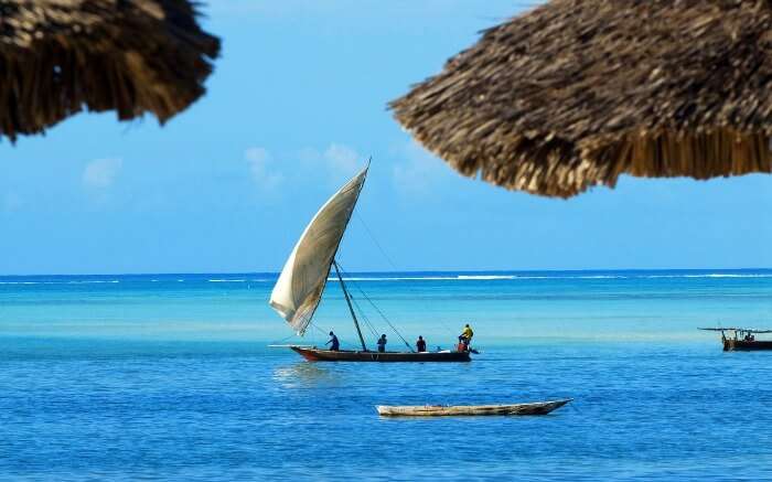Zanzibar natives rowing a boat in the sea 