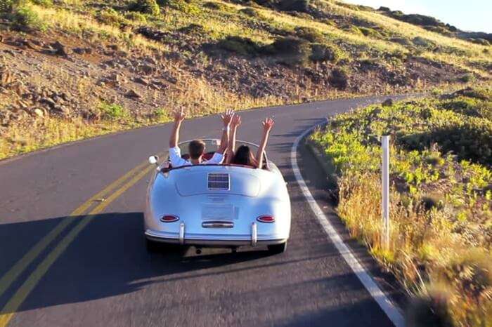 Couple taking a romantic drive in a classic car